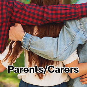 Photo of a person; a young woman, with arms of friends/family with their arms around her shoulders