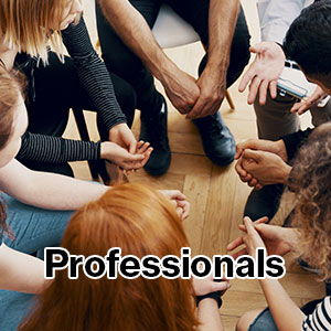 Photo of young people sitting on chairs in a circle, viewed from above.