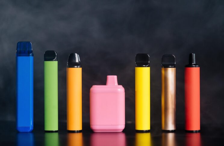 Several disposable vapes, all different colours and sizes.
